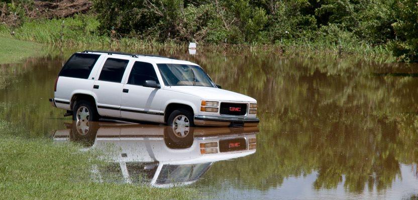 Edmund, Okla., June 15, 2010 -- A car lies in a ditch where flood waters forced it off Hefner Rd in Edmund, OK after the area experienced rain fall of almost 10 inches in six hours. (Patsy Lynch/FEMA Photo Library)
