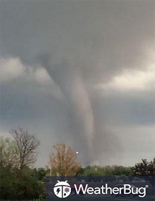Video posted to Facebook by Josie Bahr shows the tornado’s funnel cloud in Andover, KS.