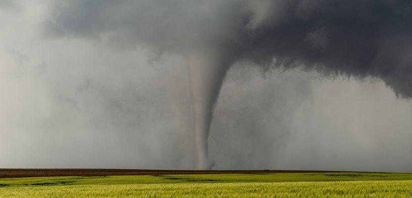 Tornado in an open field in Kansas (Huntstyle via Shutterstock)