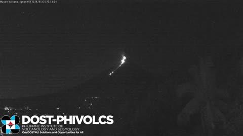 Meteor Streaks Past Erupting Volcano