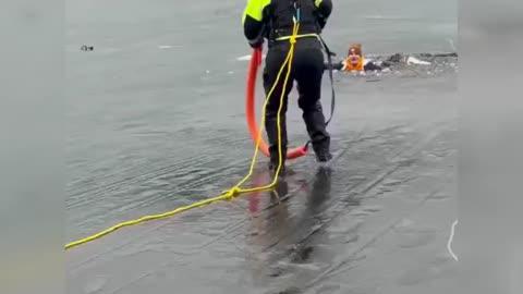 Man Falls Through Ice in Front of Rescuers