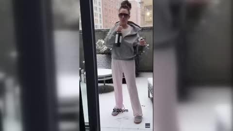 Woman in NYC Measures Snow Levels With Wine