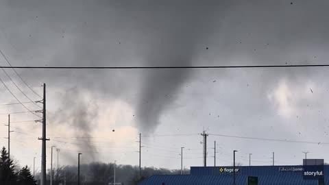 Tornado Sends Debris Flying in Front of Store
