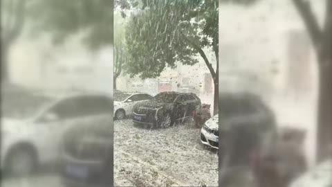 Parked Cars Pummelled by Hailstones