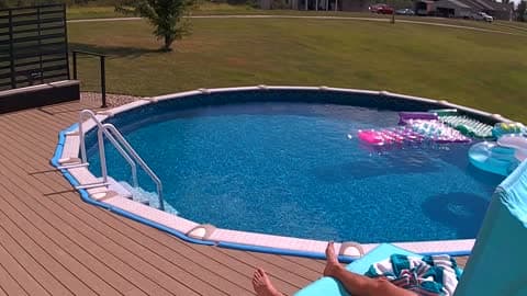 Sunbather Unfazed as Dust Devil Sends Pool Furniture Flying