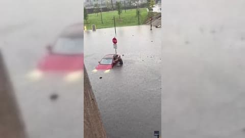 Man Attempts to Salvage Tesla After Driving Into Floodwater